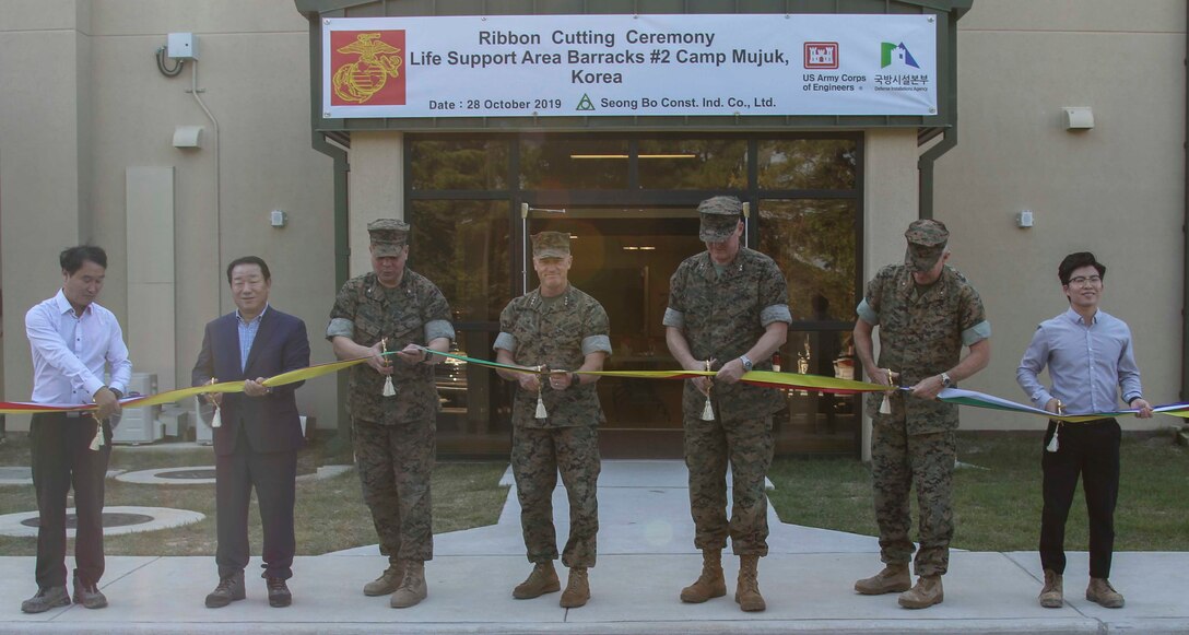 Lt. Gen. Stacy H. Clardy, Maj. Gen. Bradley S. James, Brig. Gen. William J. Bowers, and Col. Thomas D. Wood open the new expeditionary barracks by cutting a ribbon aboard Camp Mujuk, 28 October.  These barracks are the newest addition aboard Camp Mujuk, and will be home to Marines training on the peninsula. (U.S. Marine Corps photo by Sgt. Parker R. Golz)