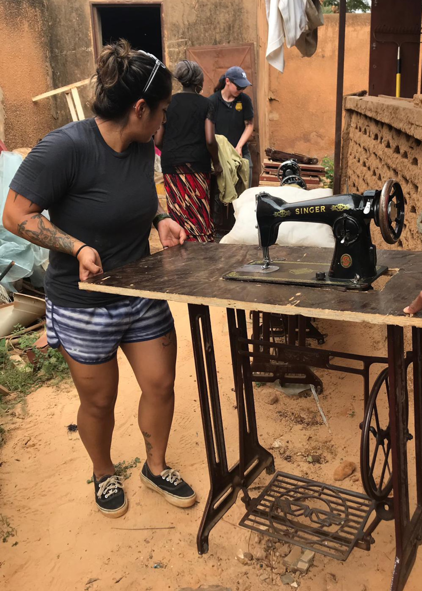 Volunteers move sewing machines in preparation for painting at the Sara-Niger Rehabilitation Center Movement for Women and Girls in Niamey, Niger. From Sept. 21 to Oct. 14, 2019, Airmen deployed to Nigerien Air Base 101 and U.S. Embassy personnel renovated the local women’s vocational school that teaches local women techniques for making clothing, providing them with a profession and a source of income. (Courtesy Photo)