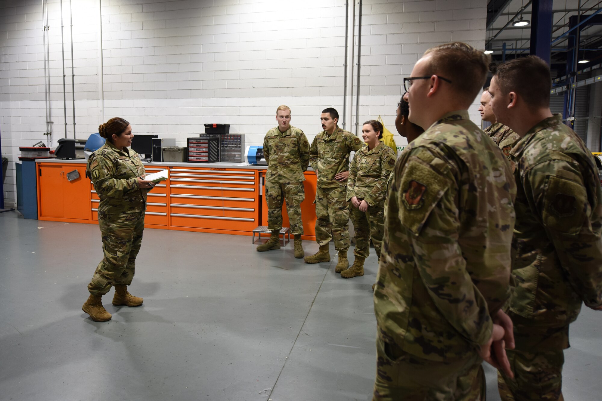 Tech. Sgt. Lorena Hodge, 48th Munitions Squadron armament support section chief, talks to her troops during an afternoon meeting at Royal Air Force Lakenheath, England, Oct. 11, 2019. Hodge was preparing for deployment and wanted to connect with her team before her departure. (U.S. Air Force photo by Airman 1st Class Jessi L. Monte)