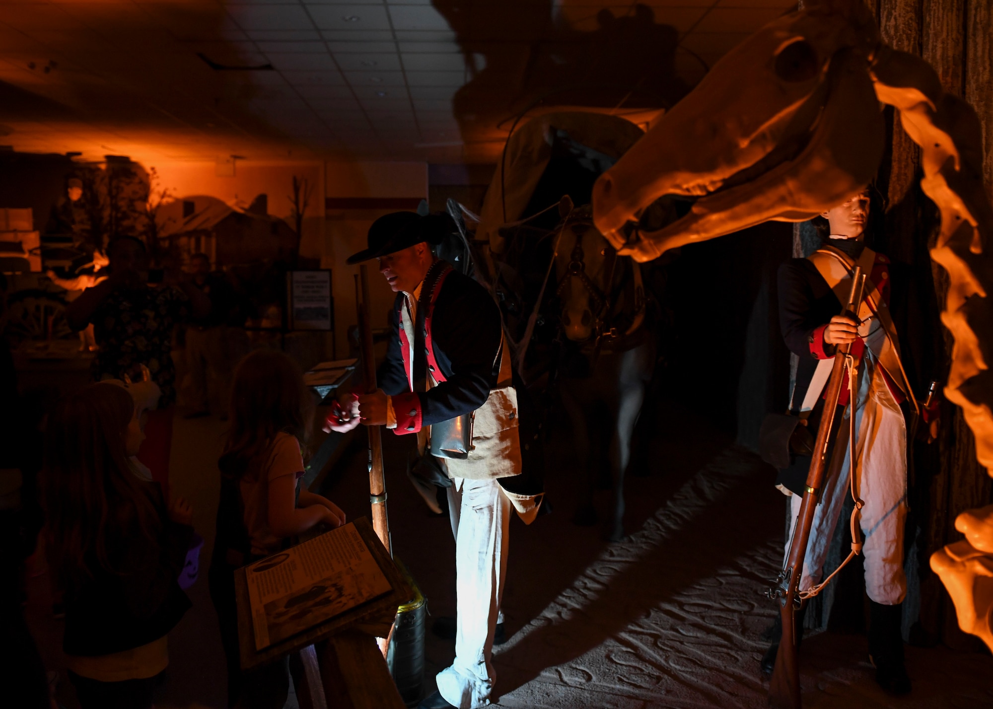 A U.S. Army Transportation volunteer gives out candy during the 10th annual Night at the Transportation Museum Halloween celebration at Joint Base Langley-Eustis, Virginia, Oct. 28, 2019.