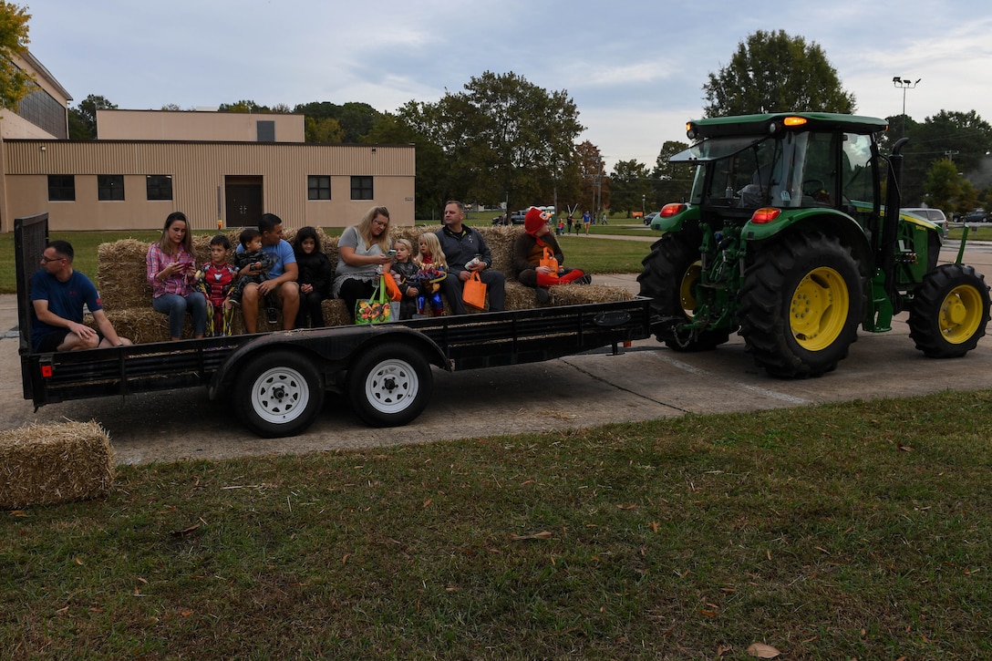 Attendees of the Fort Eustis Fall Fest take a hayride around the parking lot of the 128th Aviation Brigade at Joint Base Langley-Eustis, Virginia, Oct. 25, 2019.