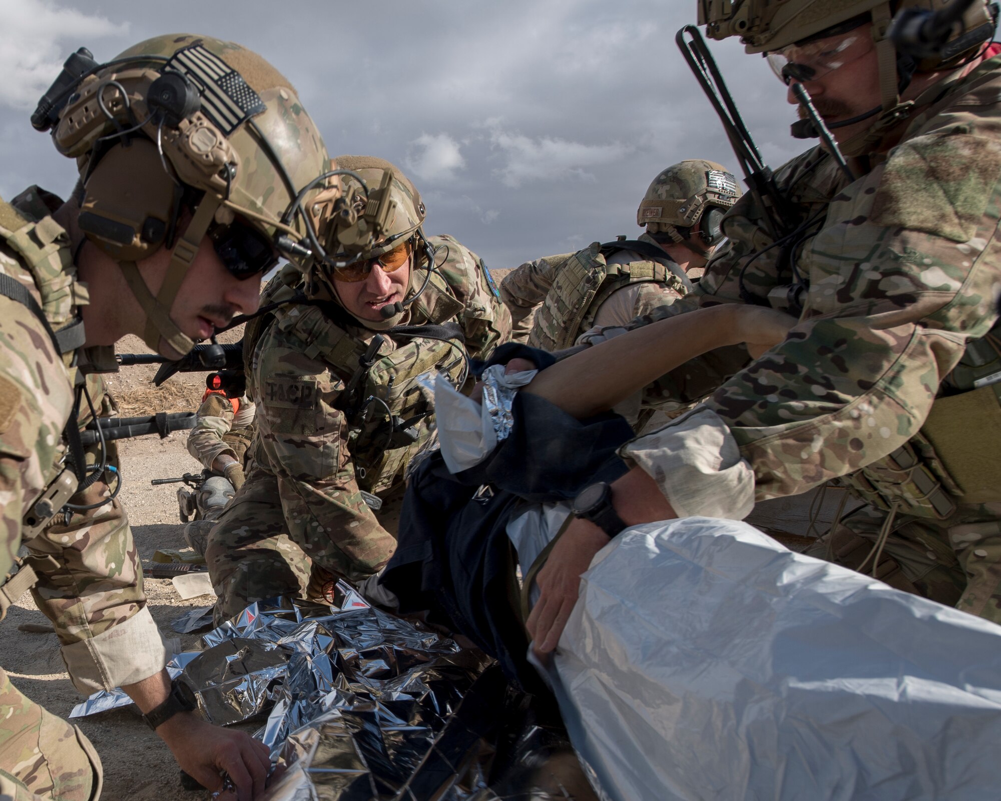 Special warfare Airmen from the 124th Air Support Operations Squadron provide Tactical Combat Casualty Care to training mannequin during a live-fire exercise near Gowen Field, Boise, Idaho, Oct. 17, 2019. The training mannequin was controlled by tablet to provide realistic input for the TACP Airmen. (U.S. Air National Guard photo by Senior Master Sgt. Joshua C. Allmaras)