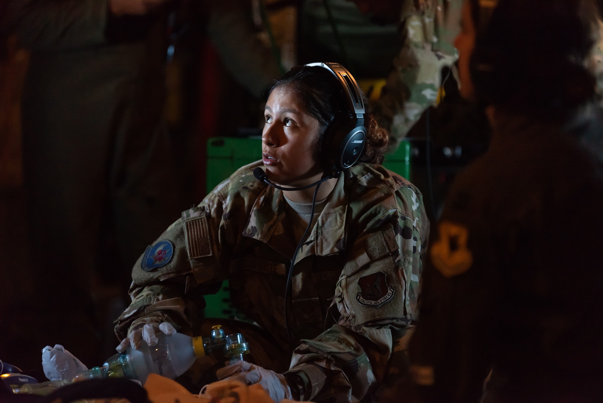 U.S. Air Force Senior Airman Erica Escalante, 18th Aeromedical Evacuation Squadron technician, simulates life-saving procedures to a training mannequin onboard a KC-135 Stratotanker during an exercise at Kadena Air Base, Japan, Oct. 8, 2019. The 18th AES maintains a forward operating presence and supports medical contingencies in a free-and-open Indo-Pacific. (U.S. Air Force photo by Senior Airman Matthew Seefeldt)