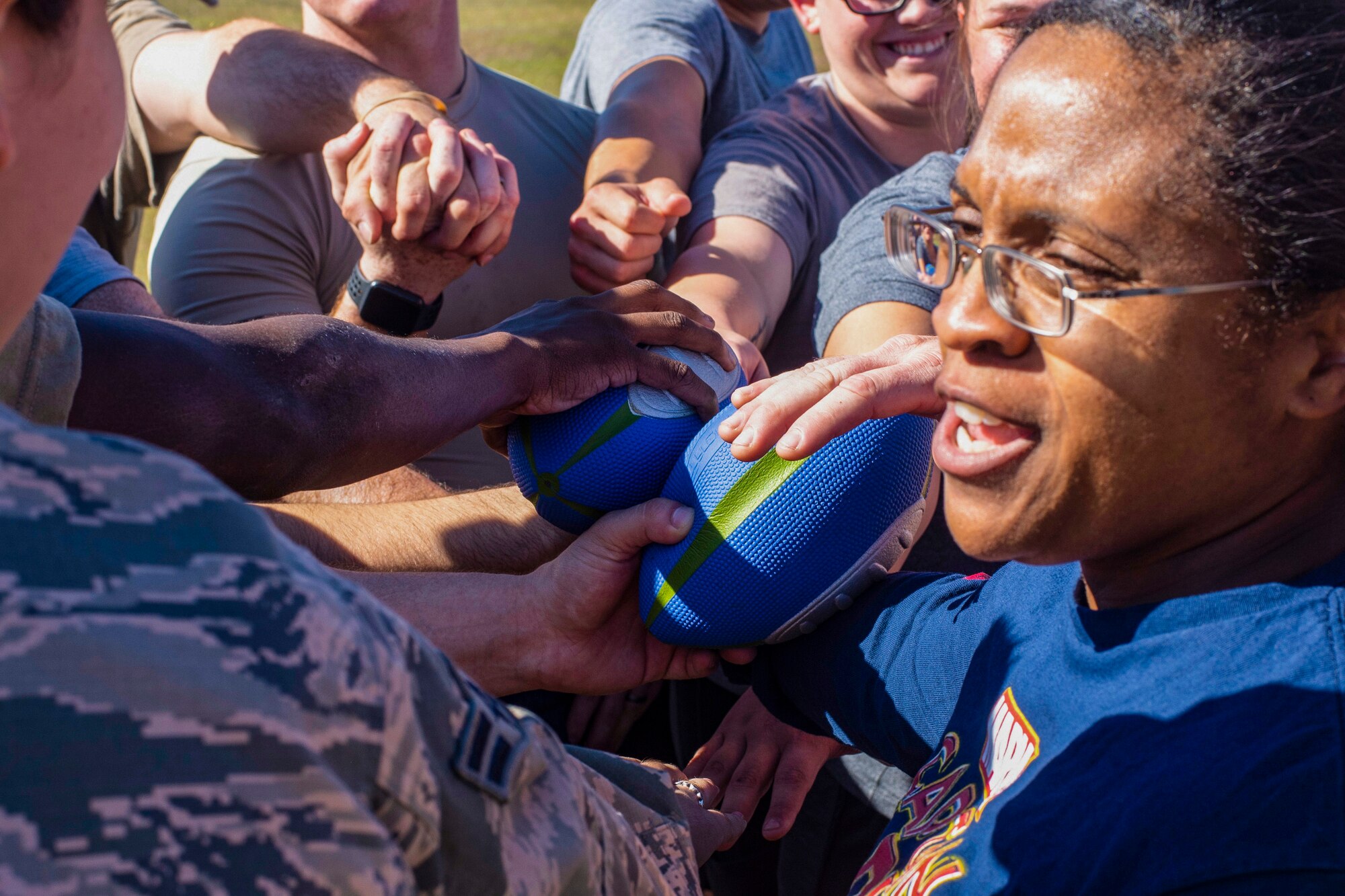 U.S. Air Force Master Sgt. Ashley Taylor, a 20th Security Forces Squadron flight chief, huddles in with her flight at the conclusion of a game at Shaw Air Force Base, South Carolina, Oct. 17, 2019.