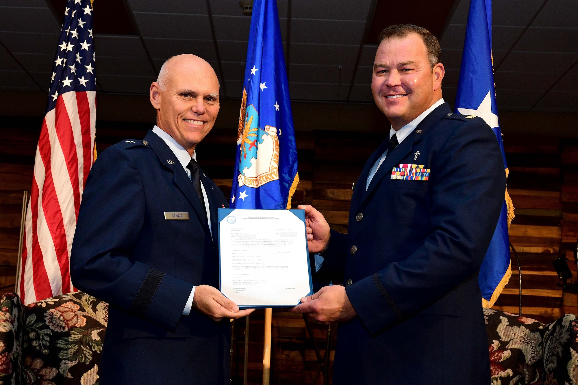 Brig. Gen. Richard Kemble, 94th Airlift commander, left, poses for a photo with Ch. Maj. Stacey Hanson during a promotion ceremony at Hanson's church in Bremen, Georgia on Oct. 20, 2019. Hanson was promoted to lieutenant colonel. (U.S. Air Force photo/Tech. Sgt. Andrew Park)