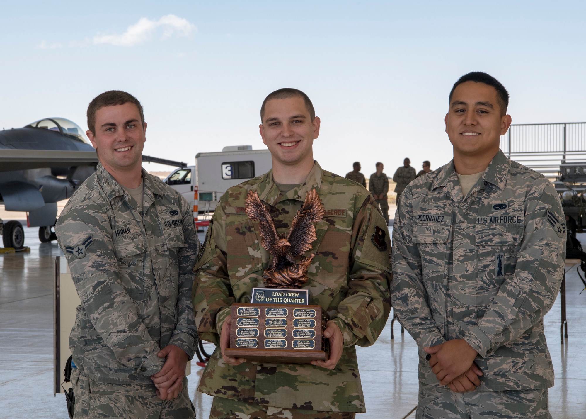 The 311th Aircraft Maintenance Unit placed first during the 2019 third quarter load competition, Oct. 28, 2019, on Holloman Air Force Base, N.M. Two F-16 Vipers and two MQ-9 Reapers were used to test the loading skills of 12 Airmen during the competition. (U.S. Air Force photo by Airman 1st Class Autumn Vogt)