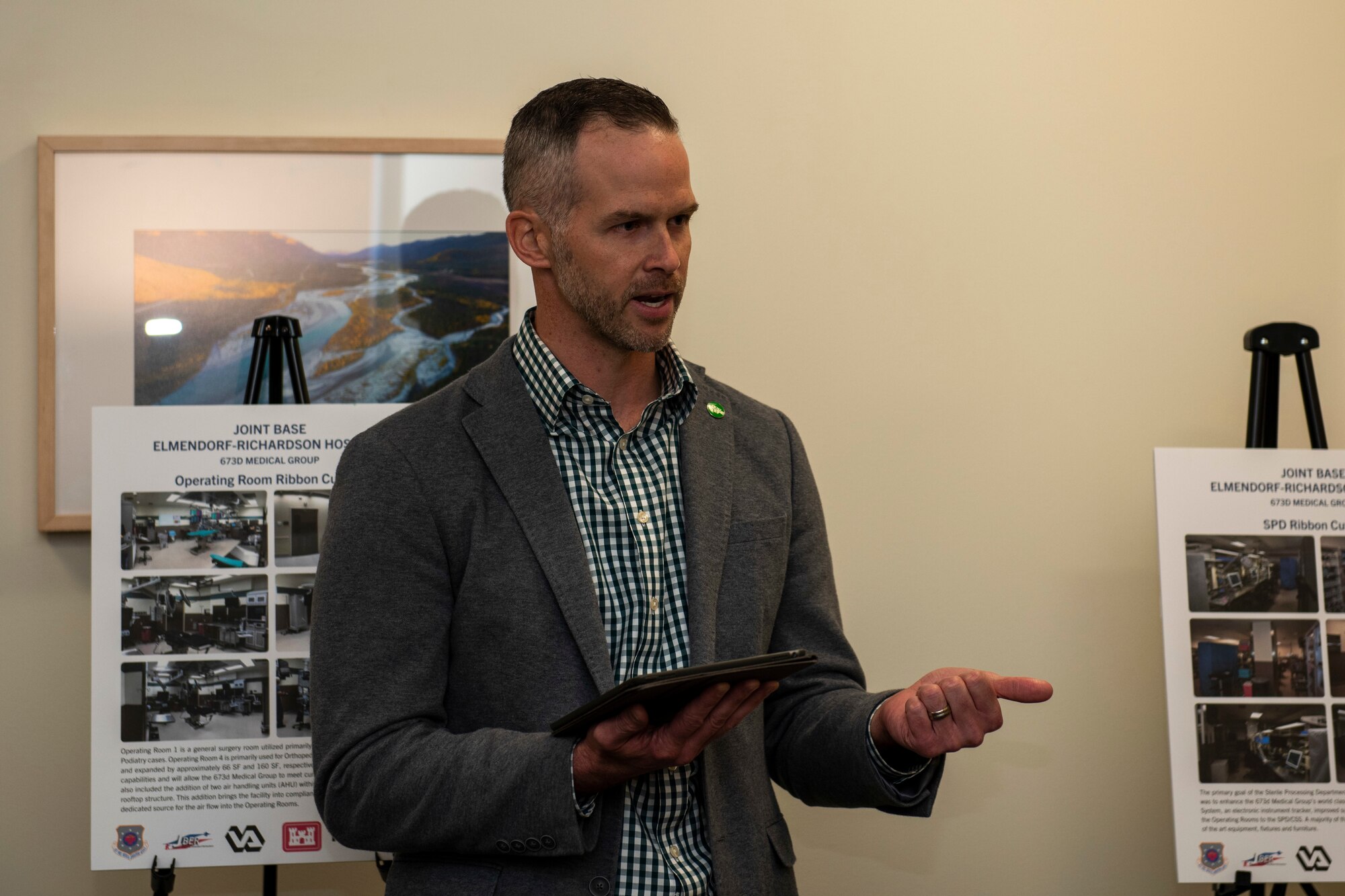 Matt Clugston, federal healthcare program manager with Walsh Construction, speaks at a ribbon-cutting ceremony for the new MRI suite in the Joint Base Elmendorf-Richardson hospital on JBER, Alaska, Oct. 28, 2019. The MRI area remodel included the creation of one joint control room, rather than the former two control rooms in separate areas; an upgraded 1.5 Tesla GE scanner; and newer patient amenities such as dressing rooms, a reception desk, a waiting area, and murals and lighting in the scanner rooms for patient comfort.