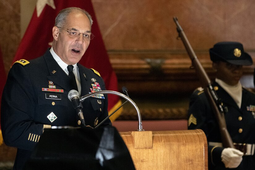 Gen. Gustave F. Perna, U.S. Army Materiel Command commanding general, left, delivers his remarks shortly after transferring command of the U.S. Army Financial Management Command from Maj. Gen. David C. Coburn to Brig. Gen. Mark S. Bennett during a ceremony at the Indiana War Memorial in Indianapolis, Oct. 25, 2019. The change of command was the first formal event for USAMCOM since its move under AMC earlier in the month. (U.S. Army photo by Mark R. W. Orders-Woempner)