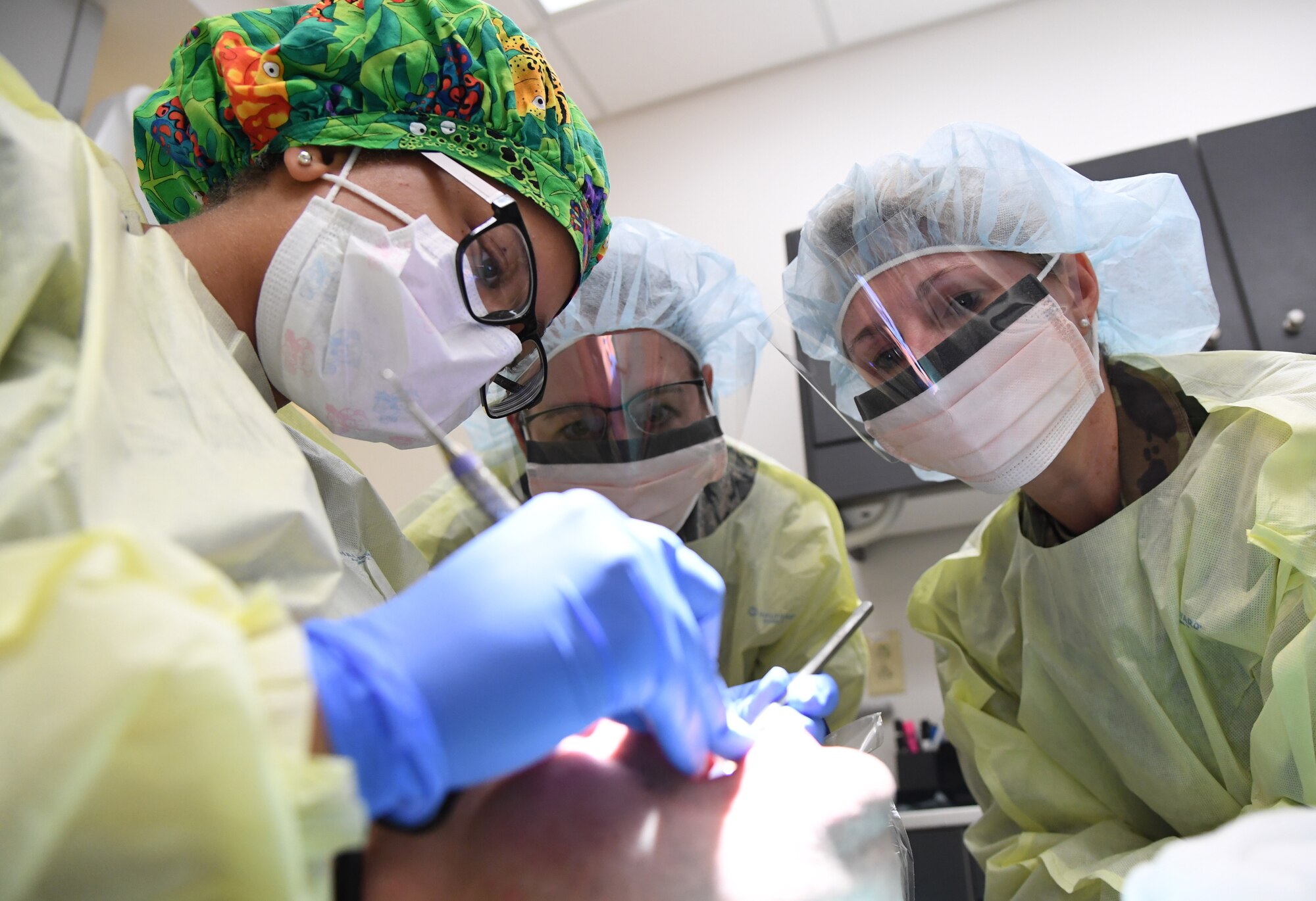 U.S. Air Force Senior Airman Ashli Walker, 81st Dental Squadron dental technician, demonstrates teeth cleaning procedures to Col. Beatrice Dolihite, 81st Medical Group commander, and Chief Master Sgt. Paula Eischen, 81st MDG superintendent, at the dental clinic inside the Keesler Medical Center at Keesler Air Force Base, Mississippi, Sept. 17, 2019. The "Dragon Medic Experience" allowed the 81st MDG leadership to work side-by-side with group medics in order to understand the challenges and barriers they may face while providing care. It also allowed them to see first-hand the great ideas that the staff has implemented to focus on the patient experience. This experience helps us cultivate an environment where senior leadership has direct engagement and connection with our front line medics who strive to deliver outstanding care. (U.S. Air Force photo by Kemberly Groue)