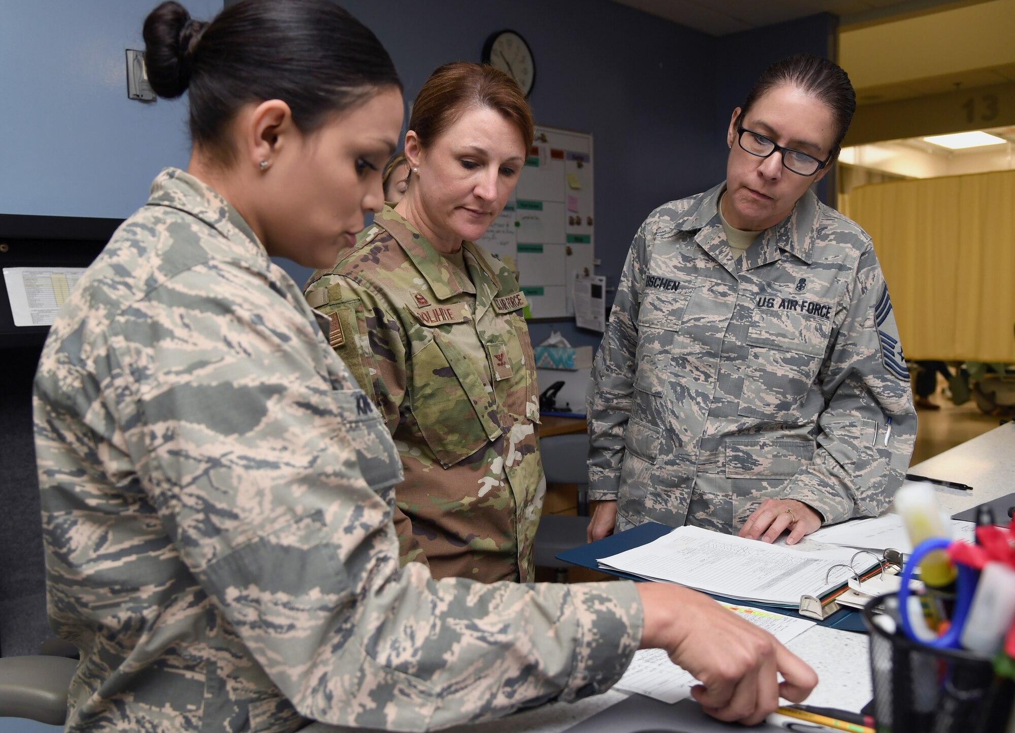U.S. Air Force 1st Lt. Monika King, 81st Surgical Operations Squadron post anesthesia care unit clinic nurse, reviews patient check-in processes and procedures with Col. Beatrice Dolihite, 81st Medical Group commander, and Chief Master Sgt. Paula Eischen, 81st MDG superintendent, at the post anesthesia care unit inside the Keesler Medical Center at Keesler Air Force Base, Mississippi, Oct. 1, 2019. The "Dragon Medic Experience" allowed the 81st MDG leadership to work side-by-side with group medics in order to understand the challenges and barriers they may face while providing care. It also allowed them to see first-hand the great ideas that the staff has implemented to focus on the patient experience. This experience helps us cultivate an environment where senior leadership has direct engagement and connection with our front line medics who strive to deliver outstanding care. (U.S. Air Force photo by Kemberly Groue)