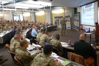 Joint Task Force Civil Support (JTF-CS) Staff Judge Advocate U.S. Army Lt. Col. Walter Narramore briefs leaders and members of the defense chemical, biological, radiological and nuclear (CBRN) response force (DCRF) and defense support to civil authorities (DSCA) during the mobile training team (MTT) held at Joint Base Lewis-McChord, Wash. The MTT focused on the CBRN mission and DSCA. The briefings are designed to train oncoming DCRF units on specific mission requirements in the event of a CBRN response. (Official DoD photo by Mass Communication Specialist 3rd Class Michael Redd/RELEASED)