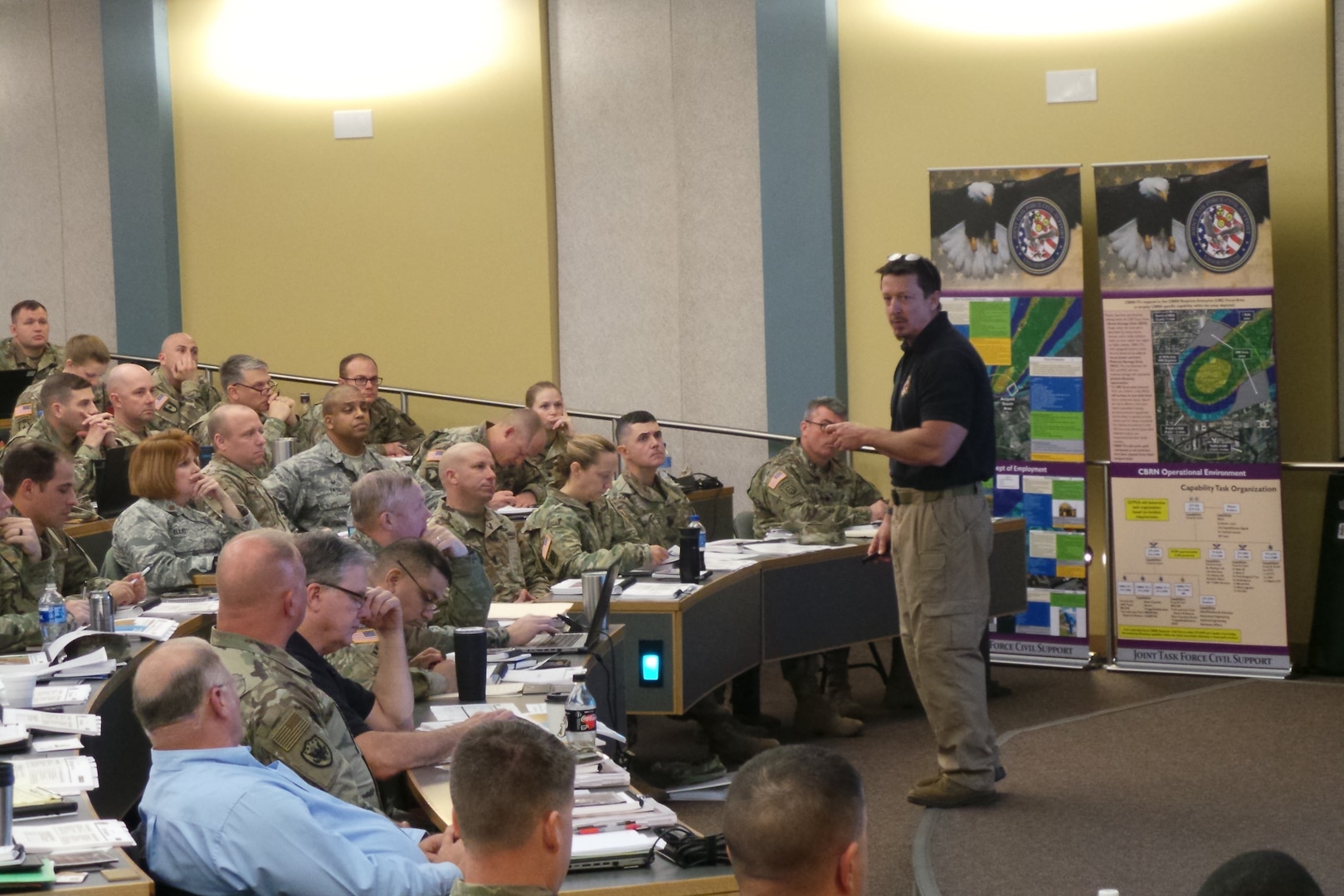 Joint Task Force Civil Support (JTF-CS) Deputy Director of Plans, Policy and Interagency Stan Bacon briefs leaders and members of the defense chemical, biological, radiological and nuclear (CBRN) response force (DCRF) and defense support to civil authorities (DSCA) during the mobile training team (MTT) held at Joint Base Lewis-McChord, Wash. The MTT focused on the CBRN mission and DSCA. The briefings are designed to train oncoming DCRF units on specific mission requirements in the event of a CBRN response. (Official DoD photo by Mass Communication Specialist 3rd Class Michael Redd/RELEASED)