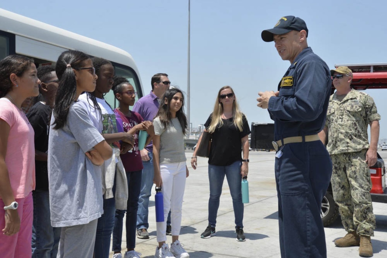 Navy ship commanding officer speaks to students.