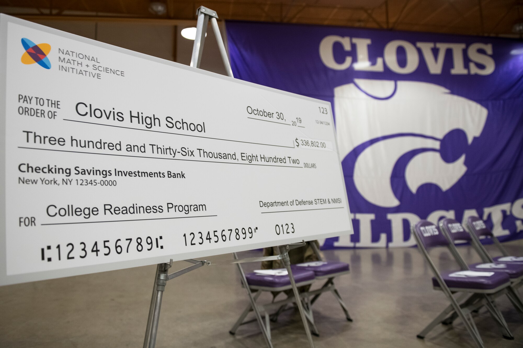 A check received at the National Math and Science Initiative program reveal rests on a podium at Clovis, N.M., Oct. 30, 2019.NMSI supports education programs to more than 255 public schools in 33 states through their Military Families Mission with a focus on Advanced Placement® courses. (U.S. Air Force photo by Senior Airman Vernon R. Walter)