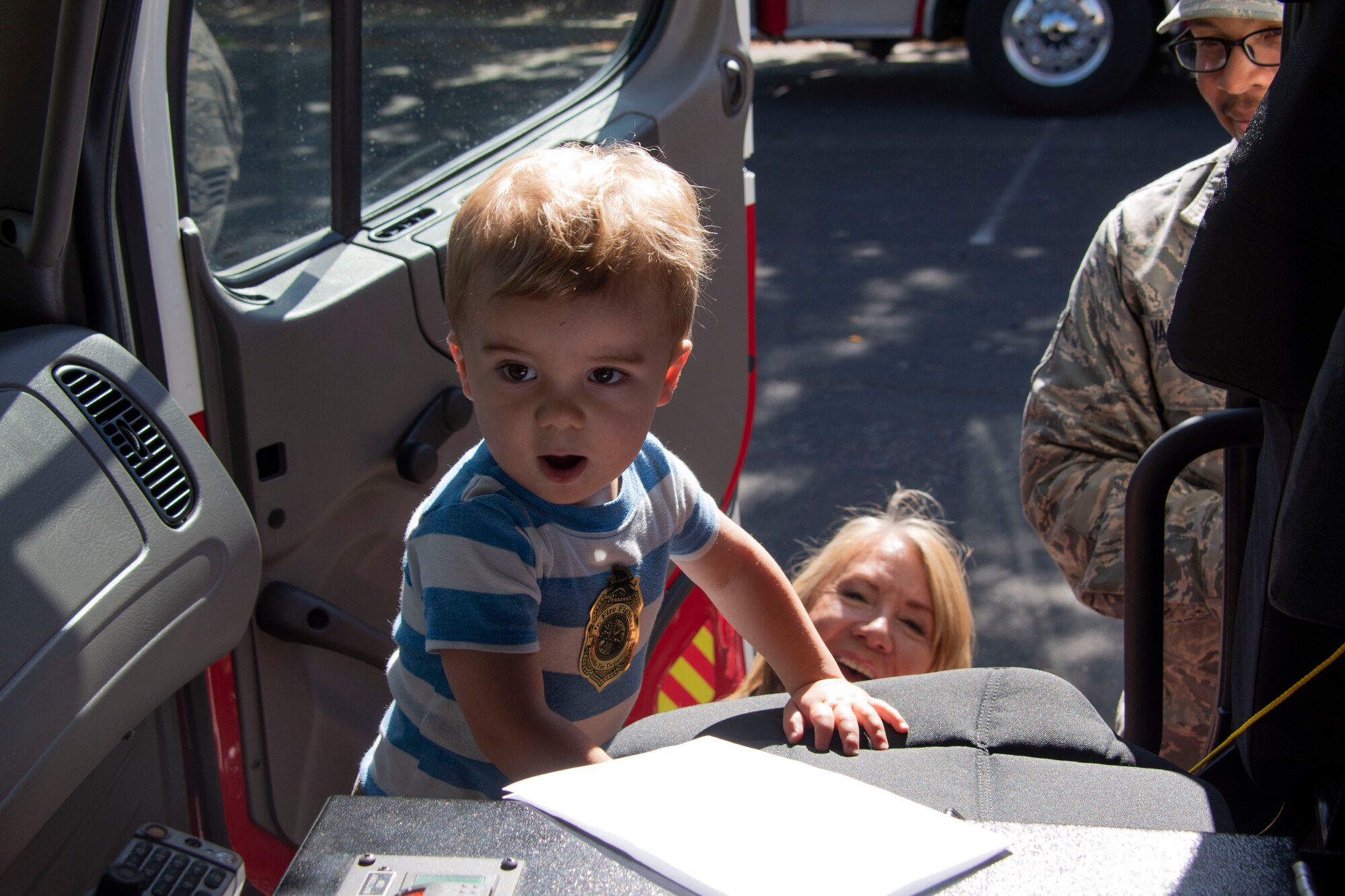 Lincoln McFadden, a toddler attending the Inspire: Dreams Start Now exhibit, stands inside a fire truck assigned to the 60th Civil Engineering Squadron, Oct. 22, 2019, at Ulatis Community Center, Vacaville, California.