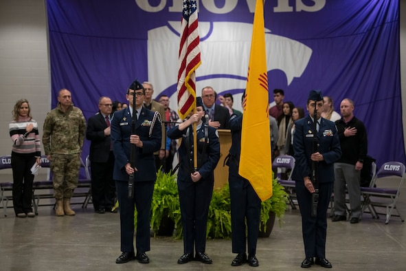 Members of the Clovis High School Junior Reserve Officers’ Training Corps stand during the national anthem at the National Math and Science Initiative program reveal at Clovis, N.M., Oct. 30, 2019. The program is a two-year College Readiness program, developed and implemented by NMSI. (U.S. Air Force photo by Senior Airman Vernon R. Walter)