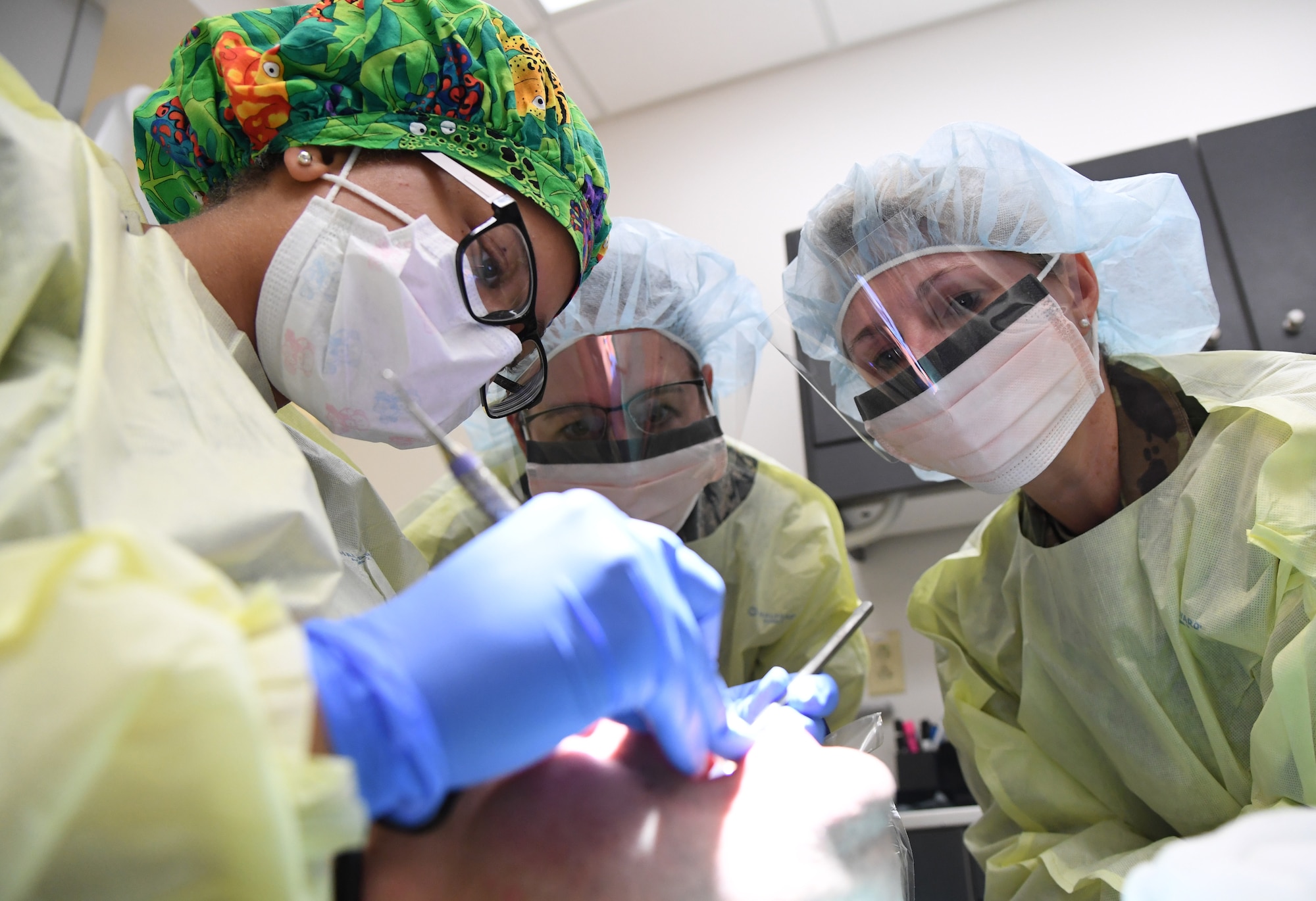 U.S. Air Force Senior Airman Ashli Walker, 81st Dental Squadron dental technician, demonstrates teeth cleaning procedures to Col. Beatrice Dolihite, 81st Medical Group commander, and Chief Master Sgt. Paula Eischen, 81st MDG superintendent, at the dental clinic inside the Keesler Medical Center at Keesler Air Force Base, Mississippi, Sept. 17, 2019. The "Dragon Medic Experience" allowed the 81st MDG leadership to work side-by-side with group medics in order to understand the challenges and barriers they may face while providing care. It also allowed them to see first-hand the great ideas that the staff has implemented to focus on the patient experience. This experience helps us cultivate an environment where senior leadership has direct engagement and connection with our front line medics who strive to deliver outstanding care. (U.S. Air Force photo by Kemberly Groue)