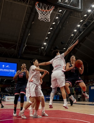 U.S. Air Force Reserve Citizen Airman Senior Airman Santia Jackson, United States Armed Forces Military World Games Women’s Basketball player, positions herself for a rebound as teammate Staff Sgt. Cinnamon Kava, drives past a Chinese defender for a layup during the Conseil International du Sport Militaire Women’s Basketball Competition in Wuhan China, Oct. 22, 2019. The 7th MWG will feature military athletes from around the world with an estimated participation of more than 100 nations and more than 10,000 participants. (U.S. Air Force photo by Staff Sergeant James R. Crow)