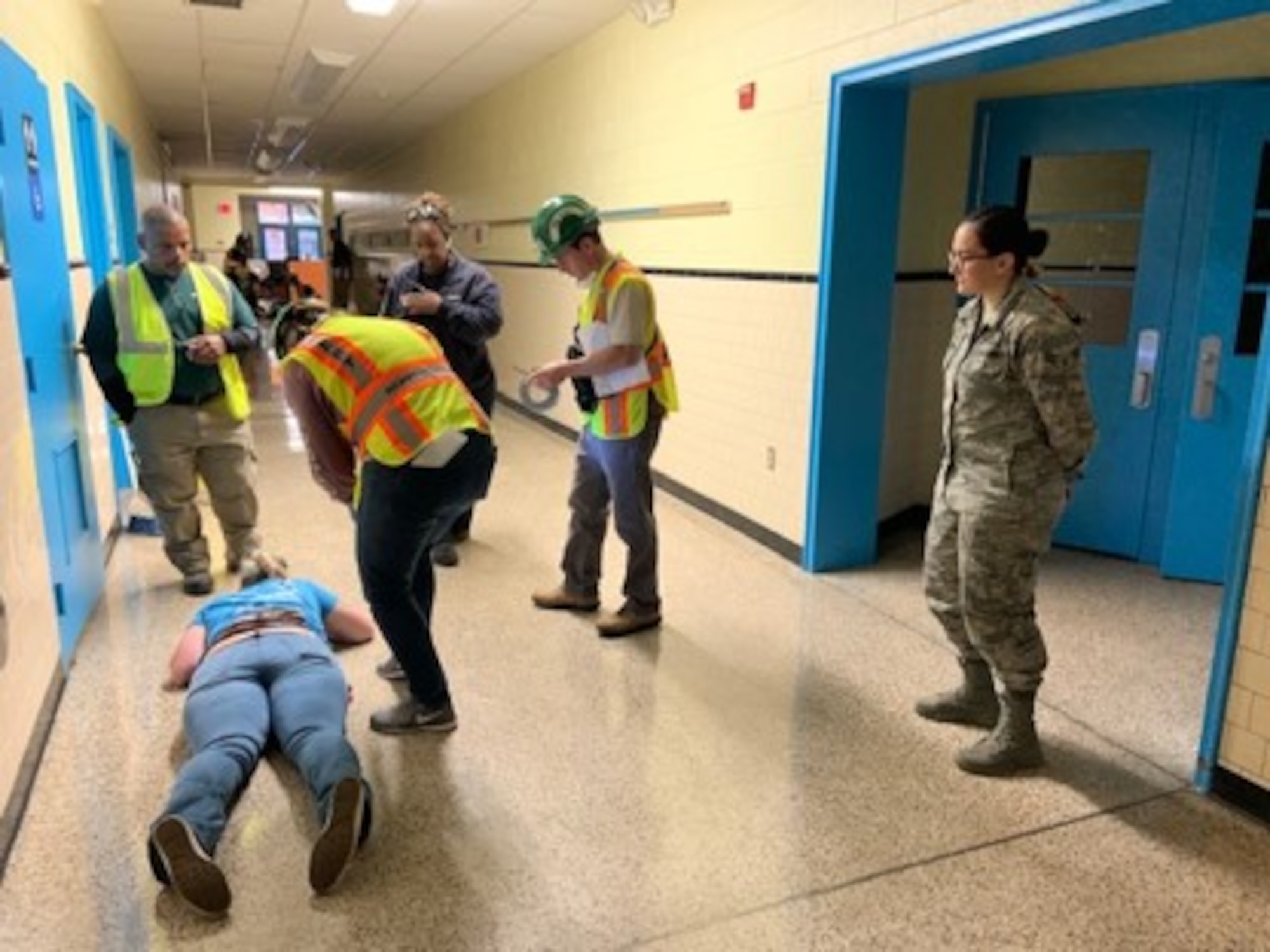 A member from the 633rd Air Base Wing Chaplain Team on Joint Base Langley-Eustis, Virginia, observes as community members participate in the Community Emergency Response Team program in Newport News, Virginia, Oct. 19, 2019. Procedures the Newport News community members conducted during CERT training are actions that members of the Chaplain Corps may encounter in a deployed environment or a disaster situation.(Courtesy photo)