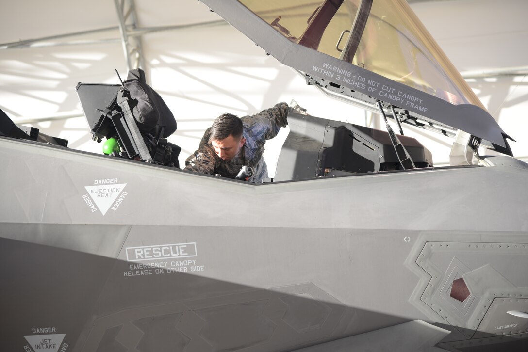 Airman 1st Class Dakota Smith, Assistant Dedicated Crew Chief, 31st Test and Evaluation Squadron, prepares an F-35 Lightning II for take off from Edwards Air Force Base, California, for the final time, Oct. 7. The 31st TES recently completed its initial operational test and evaluation mission and six F-35s were reassigned to the 422nd Test and Evaluation Squadron at Nellis Air Force Base, Nevada. (U.S. Air Force photo by Giancarlo Casem)