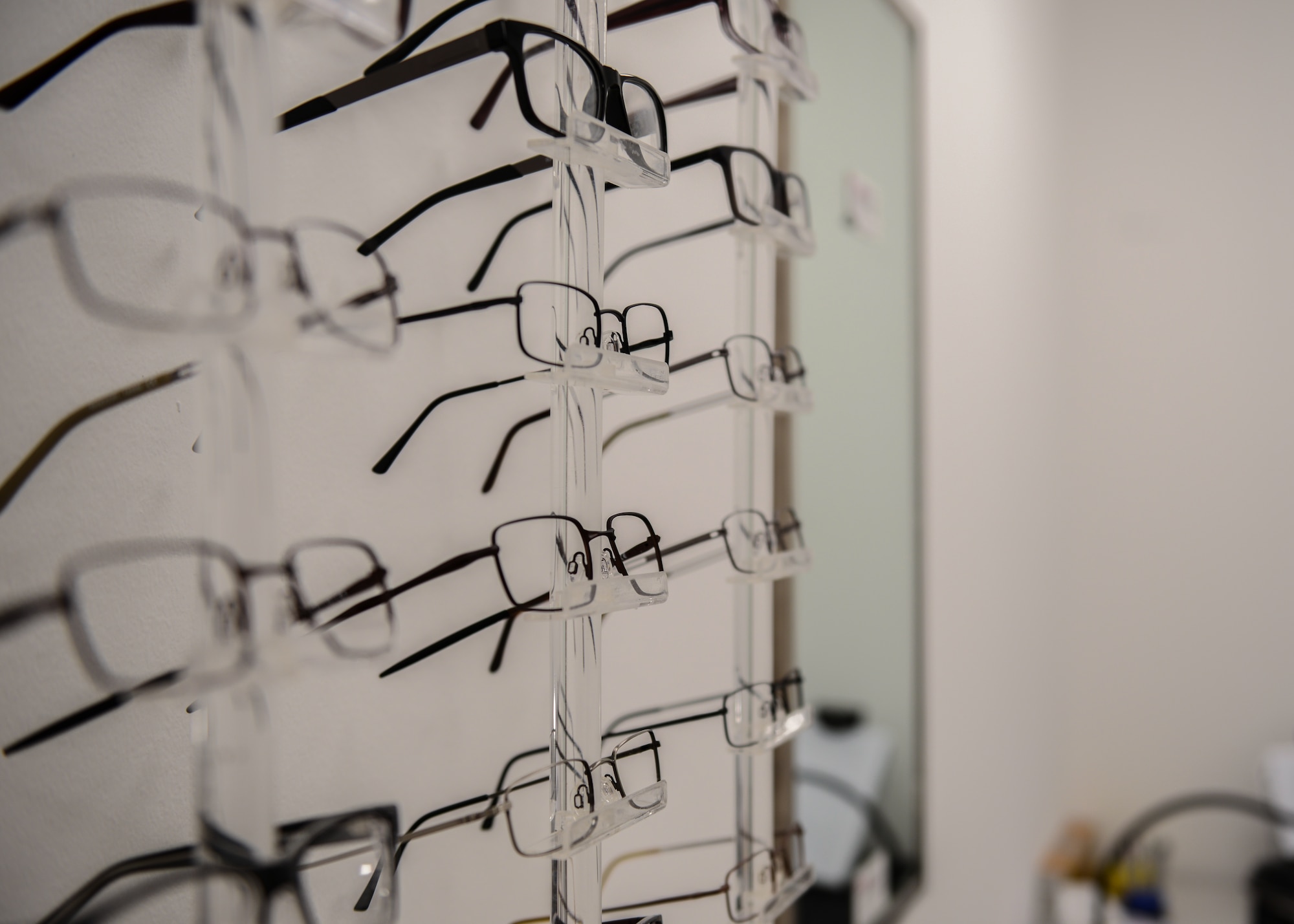 Eye glasses sit on display at the new Optometry office location, Aviano Air Base, Italy, Oct. 30, 2019. Optometry was relocated to Area F in order to provide greater convenience for patients. (U.S. Air Force photo by Airman Thomas S. Keisler IV)