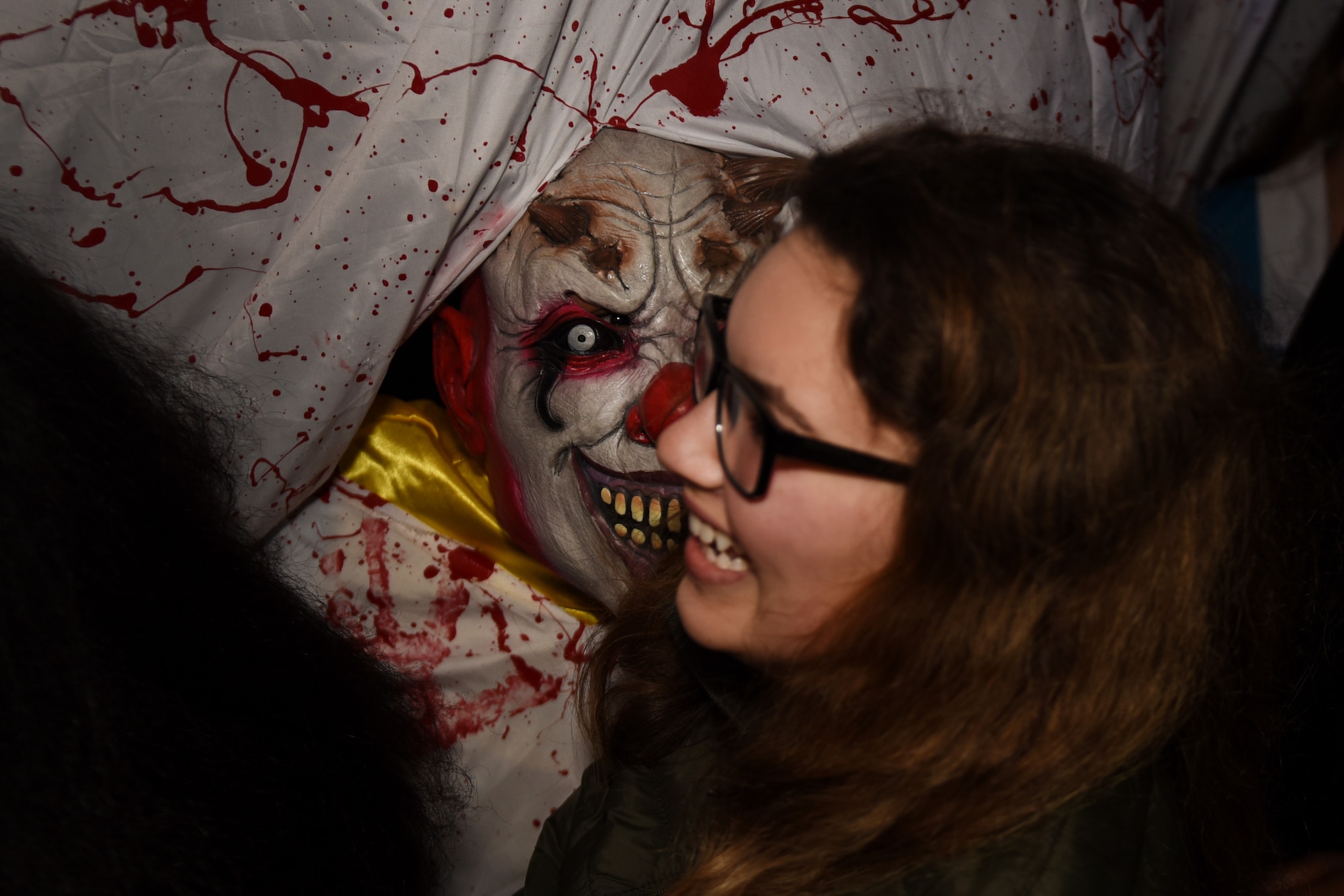 A Liberty Wing haunted hospital volunteer scares a participant at Royal Air Force Lakenheath, England, Oct. 25, 2019. It was built in an effort to provide Airmen with another option to celebrate Halloween overseas away from their families. (U.S. Air Force photo by Airman 1st Class Madeline Herzog)