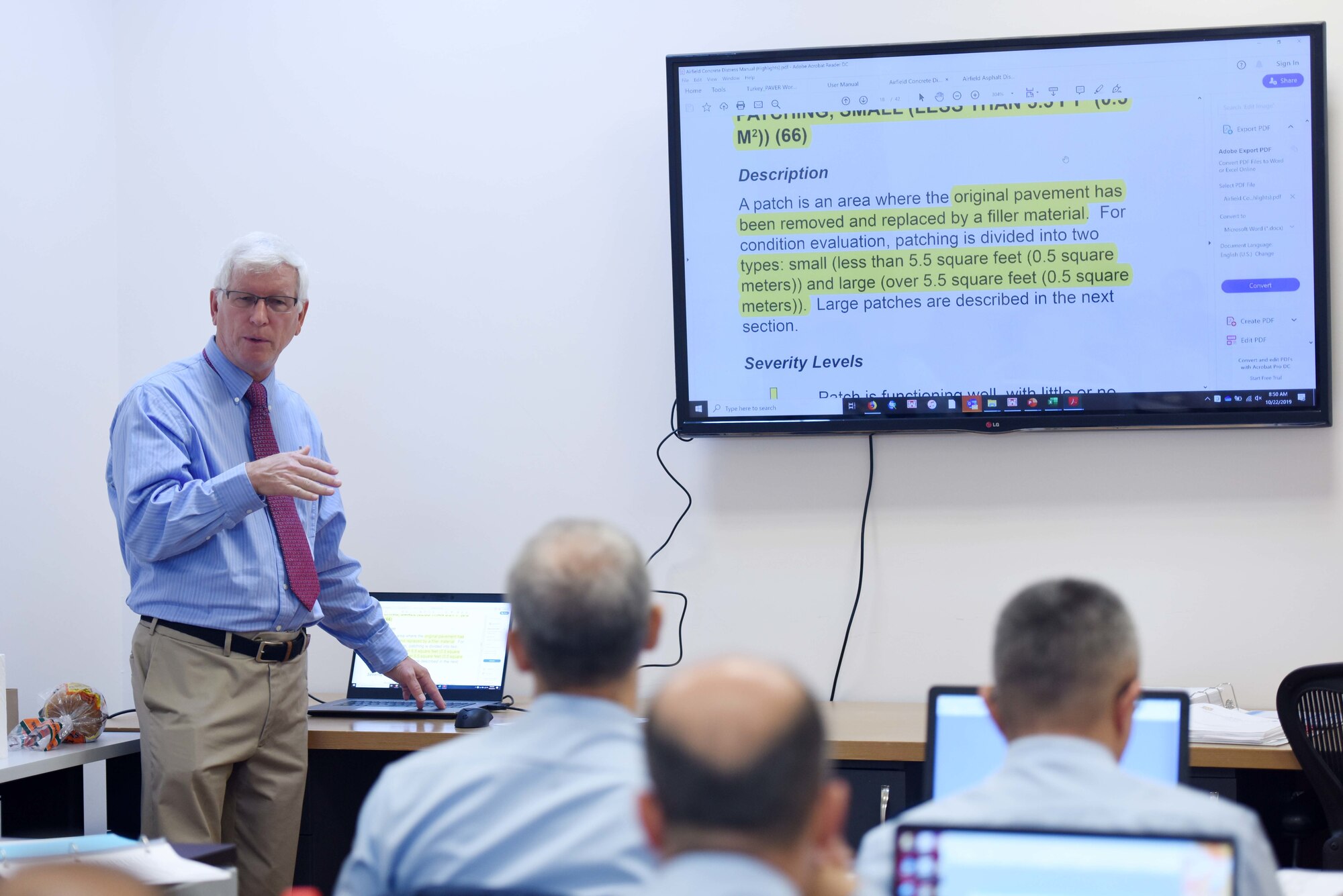 Mr. Wayne Seiler, Air Force Civil Engineer Center Paver instructor, instructs U.S. Air Force and Turkish air force members on pavement conditions during Paver training Oct. 22, 2019, at Incirlik Air Base, Turkey. Paver is a standard way of collecting data allowing anyone with any level of experience to collect and record the quantities of pavement severities. (U.S. Air Force photo by Tech. Sgt. Jim Araos)