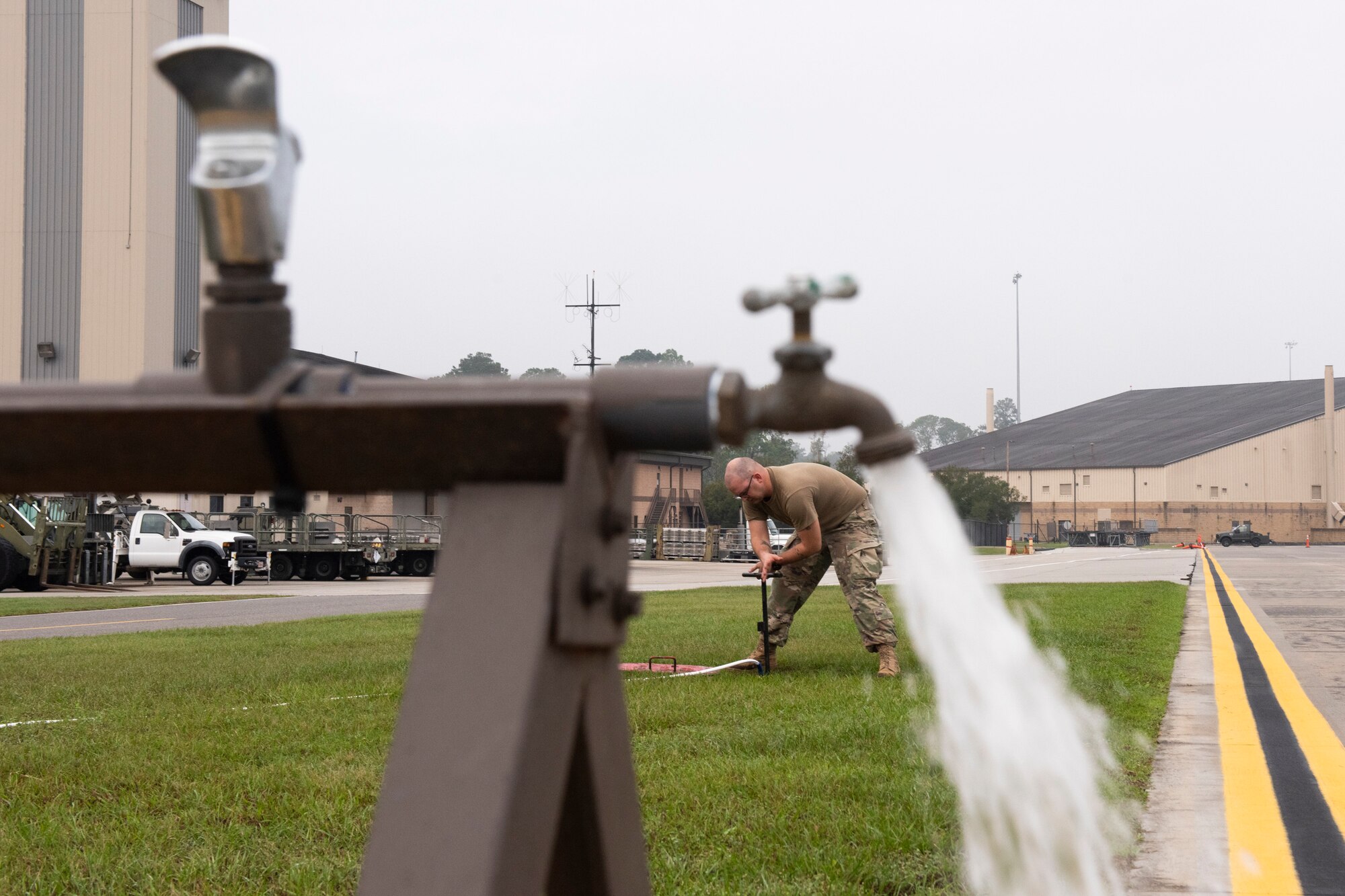 Staff Sgt. Douglas Shaw, 23d Civil Engineer Squadron (CES) water and fuel systems maintenance journeyman, tests water flow from a water pump Oct. 29, 2019, at Moody Air Force Base, Ga. The 23d CES installed water fountains around the flightline in preparation for the air show. This will give air show attendees locations for clean water and help with dehydration related injuries. (U.S. Air Force photo by Airman Elijah Dority)