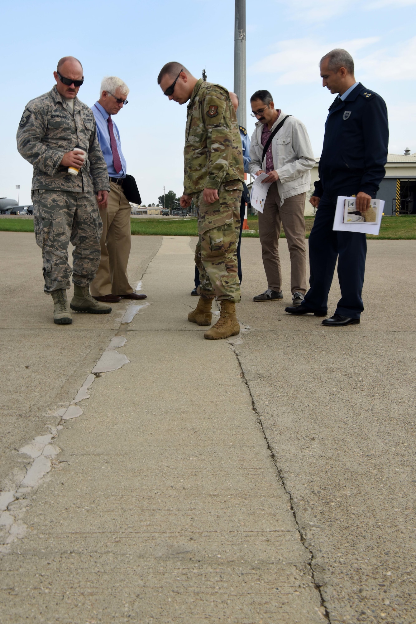 Mr. Wayne Seiler, Air Force Civil Engineer Center Paver instructor, instructs U.S. and Turkish air force members on collecting data Oct. 22, 2019, at Incirlik Air Base, Turkey. Based upon the condition rating and types of distresses recorded, engineers can estimate the total quantity of repairs needed and make decisions on what areas need reconstruction.
 (U.S. Air Force photo by Tech. Sgt. Jim Araos)