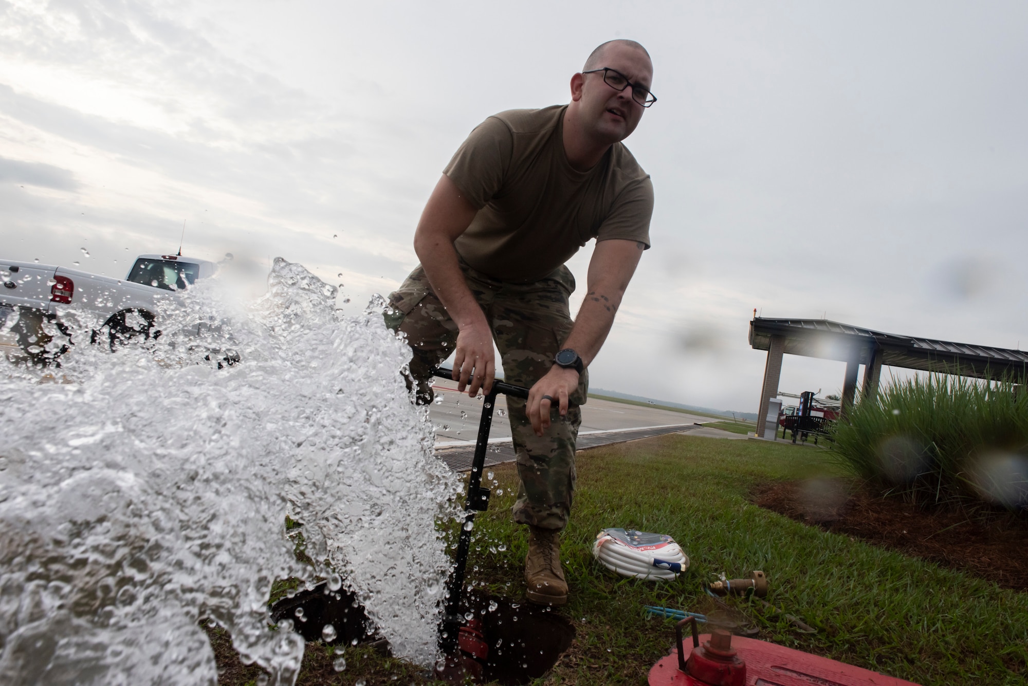 Staff Sgt. Douglas Shaw, 23d Civil Engineer Squadron (CES) water and fuel systems maintenance journeyman, clears dirty water from a water pump Oct. 29, 2019, at Moody Air Force Base, Ga. The 23d CES installed water fountains around the flightline in preparation for the air show. This will give air show attendees locations for clean water and help with dehydration related injuries. (U.S. Air Force photo by Airman Elijah Dority)