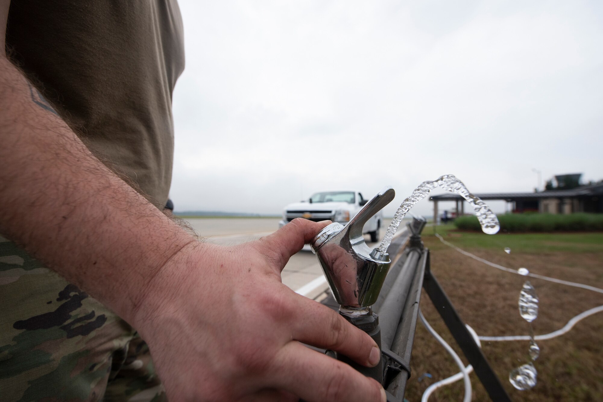 Staff Sgt. Douglas Shaw, 23d Civil Engineer Squadron (CES) water and fuel systems maintenance journeyman, tests a water fountain’s functionality Oct. 29, 2019, at Moody Air Force Base, Ga. The 23d CES installed water fountains around the flightline in preparation for the air show. This will give air show attendees locations for clean water and help with dehydration related injuries. (U.S. Air Force photo by Airman Elijah Dority)