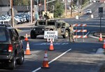 U.S. Army Spc. Maria Medina, a California Army National Guard soldier with Pittsburg-based 870th Military Police Company, blocks traffic from entering Healdsburg, California, Oct. 28, 2019, after an evacuation order was given to multiple towns near the Kincade Fire in Sonoma County.