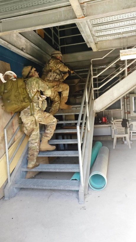 Soldiers from the 329th Ground Ambulance Company clear a building as part of the St Luke’s Field Ambulance Validation Event, hosted by the Canadian Armed Forces, 25 Field Ambulance, in Toronto, Ontario, Oct. 26th.