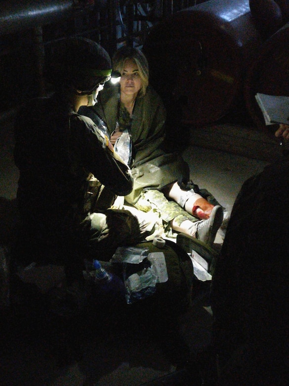 Pfc. Carleigh Landers provides care to a patient the St Luke’s Field Ambulance Validation Event, hosted by the Canadian Armed Forces, 25 Field Ambulance, in Toronto, Ontario, Oct. 26th.