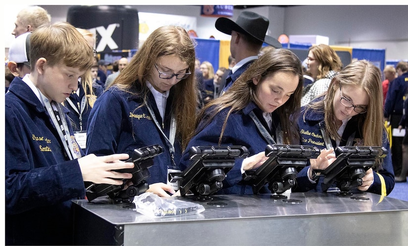 Members of Future Farmers of America use EMM Connect to register at the Army Interactive zone during this year's annual FFA convention in Indianapolis, Indiana Oct. 30.