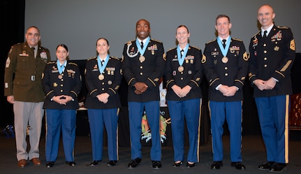 Command Sgt. Maj. Alberto Delgado, U.S. Army North Command Sergeant Major (left) with the Sergeant Audie Murphy Club inductees (from left Staff Sgt. Jazmi I. Swingler, Staff Sgt. Brandy M. Ritch, Staff Sgt. Charles E. Mays Jr., Staff Sgt. Kacie M. Kennedy, Staff Sgt. Alexander H. Bach, and Sergeant Maj. James Musnicki, U.S. Army Medical Center of Excellence Directorate of Training and Academic Affairs Sergeant Major.