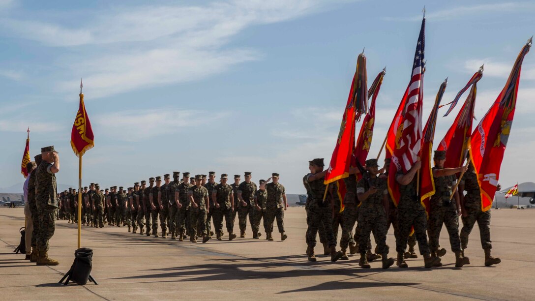 Leaders of 3rd Marine Aircraft Wing (MAW), salute the colors as they pass during a change of charge ceremony on Marine Corps Air Station Miramar, Calif., Oct. 30, 2019. The ceremony recognized U.S. Navy Command Master Chief Donald L. Davis' service, leadership and dedication to 3rd MAW. (U.S. Marine Corps photo by Lance Cpl. Jaime Reyes)