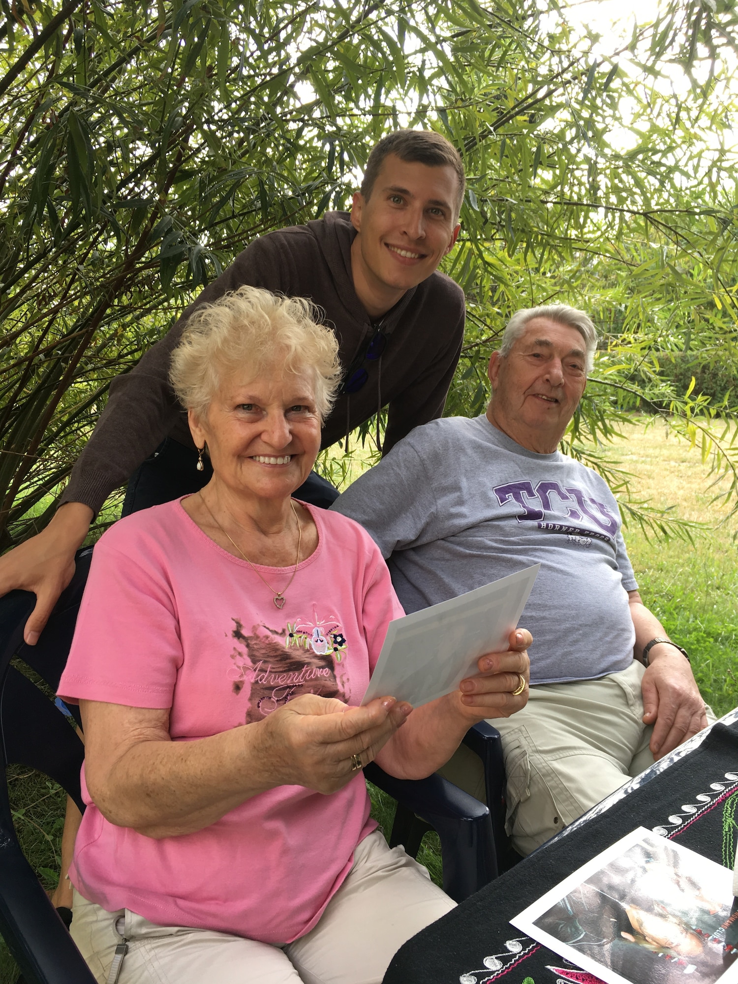 Senior Airman Andrea Gehde, a client systems technician from the 521st Air Mobility Operations Group, poses for a photo with his grandparents, Helga and Joachim Gehde, who say that relief supplies dropped over Berlin by Col Gail Halvorsen and his crewmates during Operation Vittles, helped save their lives. (Courtesy photo)