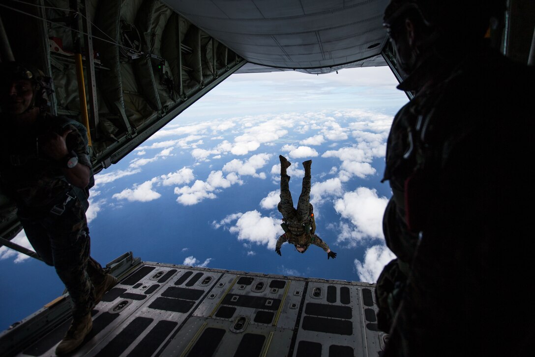 A Marine jumps out of a plane.