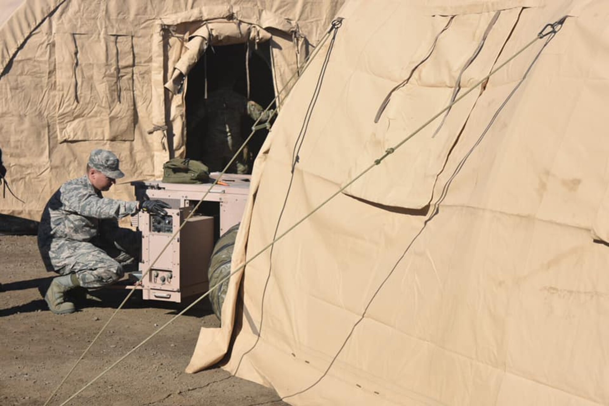 U.S. Air Force Airman Cody Daffron, assigned to the California Air National Guard’s 144th Fighter Wing, finalizes the installation of a generator at Camp Ghilotti, in Santa Rosa, California, Oct. 30. Airmen from around California have converged on the Ghilotti Construction site to set up up the Disaster Relief Beddown System that will serve as the home base of California Guardsmen supporting state and local agencies battling the Kincade Fire. (U.S. Army National Guard photo by Sgt. 1st Class Benjamin Cossel)