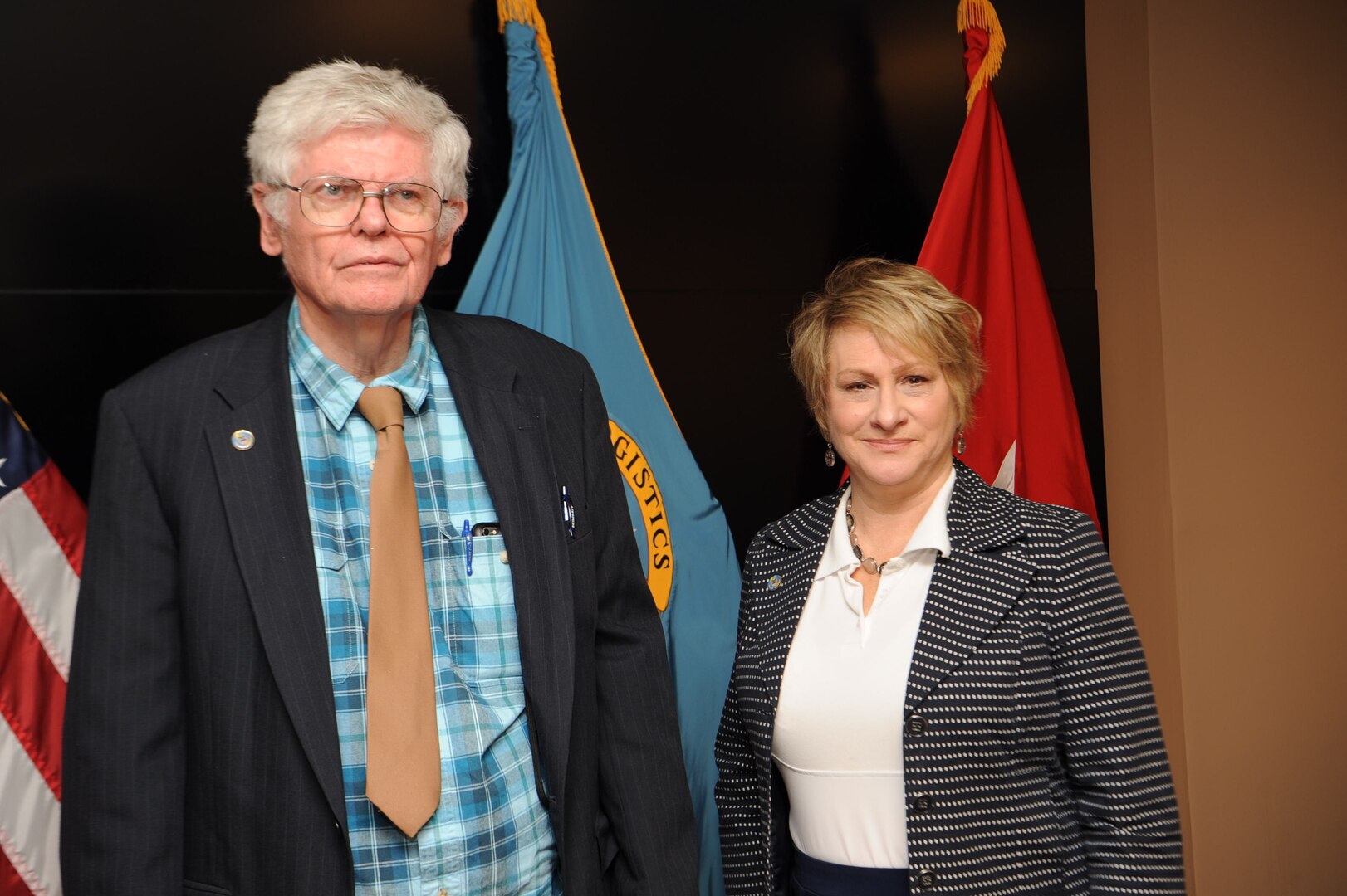 James McCloskey, left, and Stephanie Fuss, both of the Defense Logistics Agency Troop Support’s Procurement Process Support office, retired this week after 54 and 40 years of federal service, respectively. They were celebrated during a civilian retirement ceremony held Oct. 30, 2019 at DLA Troop Support Headquarters in Philadelphia. (Photo by Edward Maldonado)