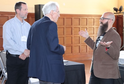 (From right) Socrates Frangis, technical lead for cybersecurity at NSWC PHD, speaks to Ron Rieger, director of artificial intelligence with Semtech Corp. in Camarillo, Calif., and Paul Witman, Ph.D., director of graduate programs in information technology at California Lutheran University, Thousand Oaks, Calif., about the growing need for cybersecurity systems and experts in both the private and public sectors.