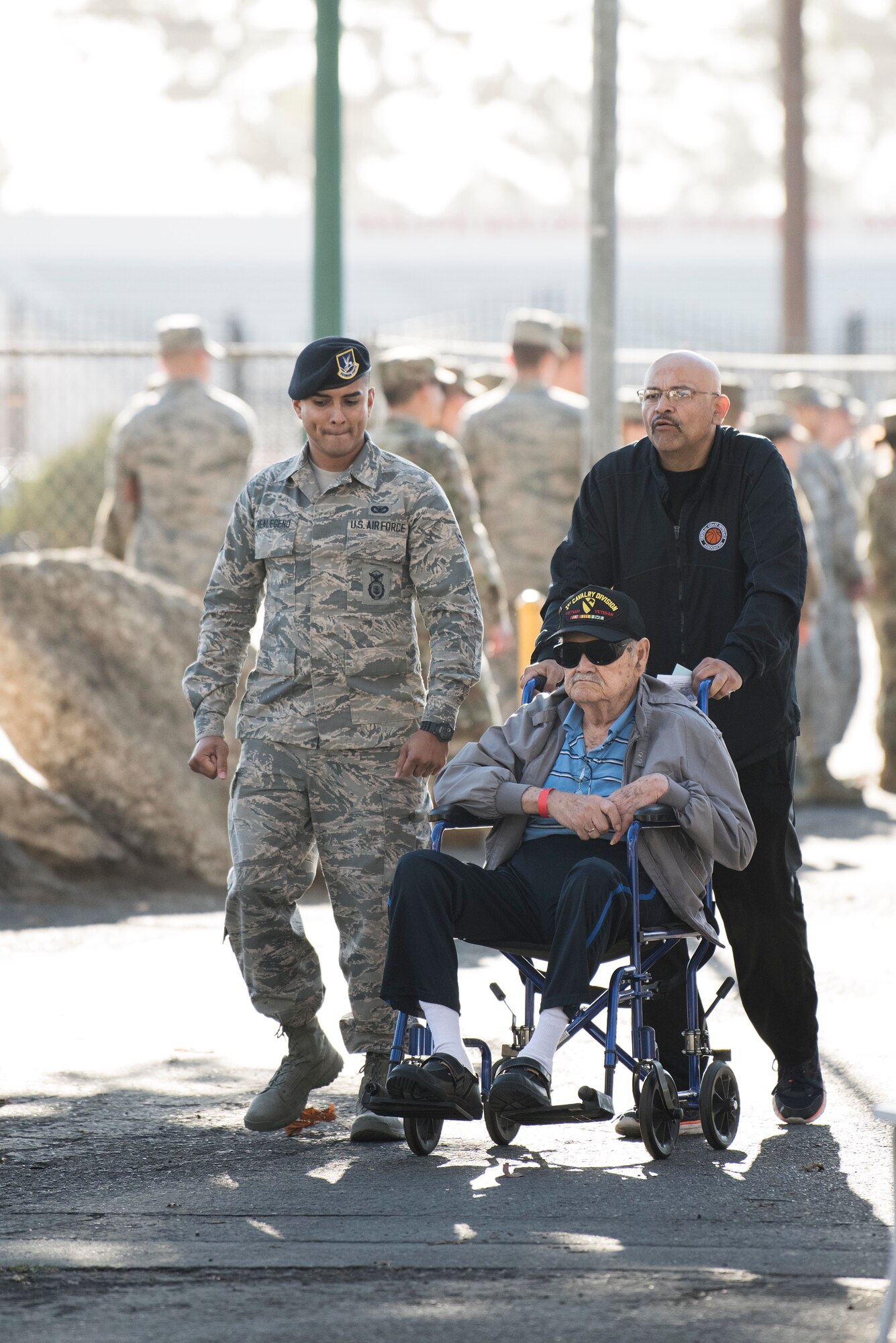 Airman 1st Class Jonathan Realegeno, 30th Security Forces Squadron defender, accompanies a veteran during the 2019 Santa Barbara County Veteran Stand Down event Oct. 19, 2019, in Santa Maria, Calif. The Veteran Stand Down is an annual event dedicated to helping veterans, homeless veterans and the family of veterans by providing them with an array of services, food and the opportunity to connect with other veterans and active duty members. (U.S. Air Force photo by Airman 1st Class Hanah Abercrombie)