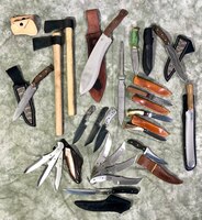 Master Sgt. Casey Cleveland, 507th Aircraft Maintenance Squadron maintenance supervisor, displays a collection of his handmade blades Oct. 22, 2019, at Tinker Air Force Base, Oklahoma. Cleveland recently competed on the bladesmithing competition show Forged in Fire on the History Channel. (U.S. Air Force photo by Senior Airman Mary Begy)
