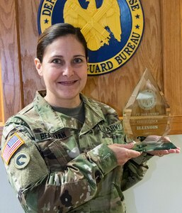 Col. Melissa Beauman, Illinois National Guard’s United States Property and Fiscal Office, with the Fiscal Stewardship Award presented to the Illinois National Guard by the National Guard Bureau’s Directorate of Programs and Resources, during the annual USPFO workshop. This is the second consecutive year the Illinois National Guard has earned the Fiscal Stewardship Award, an award noting USPFO’s work to be excellent stewards of taxpayer dollars. (U.S. Army photo by Barbara Wilson, Illinois National Guard Public Affairs Office)
