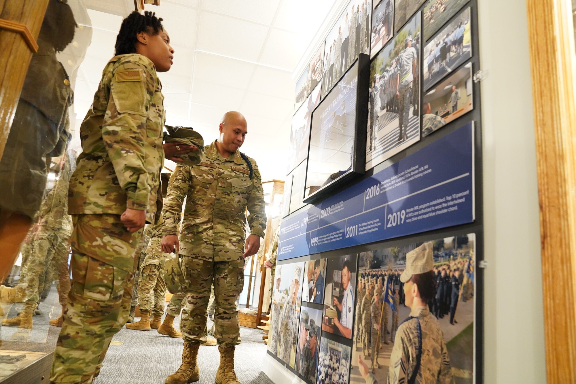 Military training leaders view the brand-new MTL wall at the Air Force Enlisted Heritage Hall at Maxwell Air Force Base Gunter Annex, Alabama, Oct. 30, 2019. MTLs play a vital role in the development of the next generation of Air Force leaders, warfighters, and protectors of freedom. The Air Force Enlisted Heritage Hall has dedicated a wall to highlight their lineage and contributions to the Air Force. (U.S Air Force photo by Airman 1st Class Spencer Tobler)