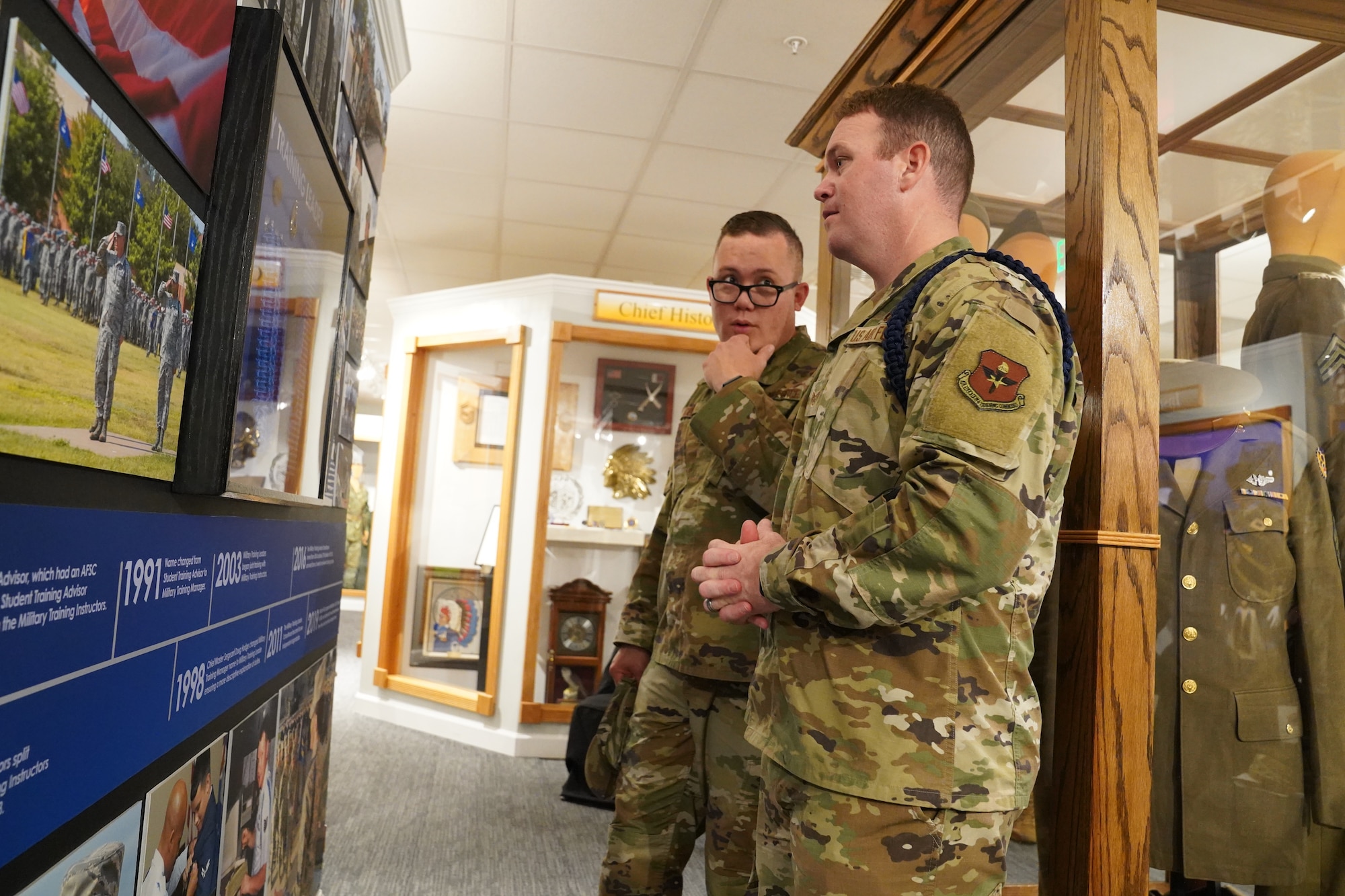 Military training leaders review the brand-new MTL wall at the Air Force Enlisted Heritage Hall at Maxwell Air Force Base Gunter Annex, Alabama, Oct. 30, 2019. MTLs play a vital role in the development of the next generation of Air Force leaders, warfighters, and protectors of freedom. The Air Force Enlisted Heritage Hall has dedicated a wall to highlight their lineage and contributions to the Air Force. (U.S Air Force photo by Airman 1st Class Spencer Tobler)