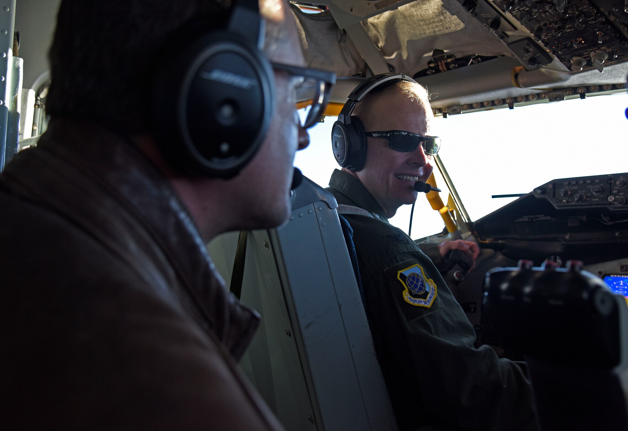 U.S. Air Force Col. Derek Salmi, 92nd Air Refueling Wing commander, talks to Jeff Vom Saal, Team Fairchild honorary commander, about in-flight operations during a civic leader tour to Scott Air Force Base, Illinois, Oct. 16.  The tour is designed to increase civic leaders’ understanding of Air Mobility Command, United States Transportation Command, 618th Air Operations Command and how the community can impact Airmen’s quality of life. (U.S. Air Force photo by Senior Airman Jesenia Landaverde)