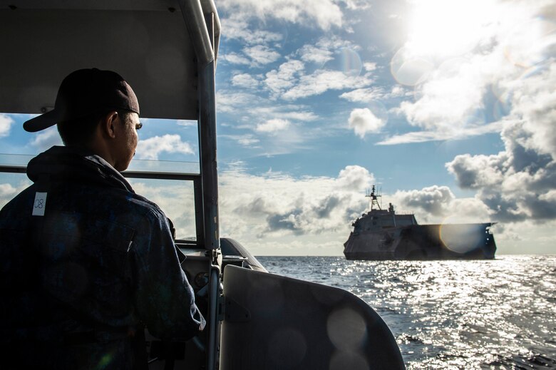 SOUTH CHINA SEA (Oct. 30, 2019) A Royal Brunei Navy rigid hull inflatable boat (RHIB) approaches the Independence-variant littoral combat ship USS Montgomery (LCS 8) during a passenger transfer in support of Cooperation Afloat Readiness and Training (CARAT) Brunei. This year marks the 25th iteration of CARAT, a multinational exercise designed to enhance U.S. and partner navies' abilities to operate together in response to traditional and non-traditional maritime security challenges in the Indo-Pacific region.