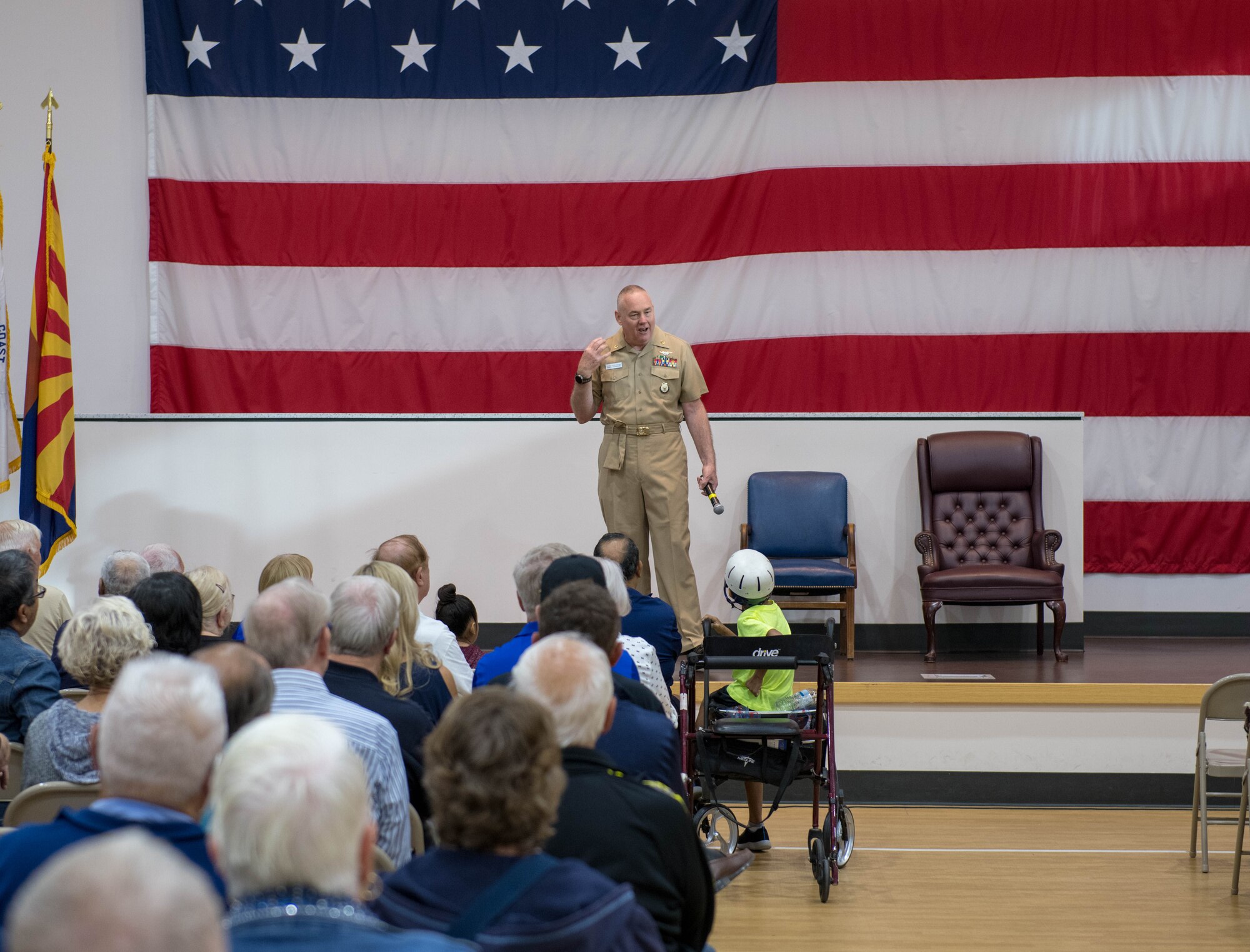 Retired Senior Chief Petty Officer Eric W. Wenzel, Secretary of the Navy Retiree council recorder, speaks at a Retiree Appreciation Day (RAD) event Oct. 26, 2019, at the Navy Operational Support Center at Luke Air Force Base, Ariz.